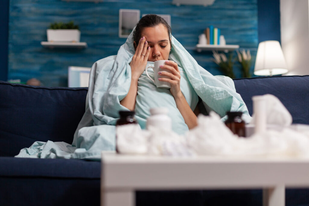 a woman facing cold air issue and headache