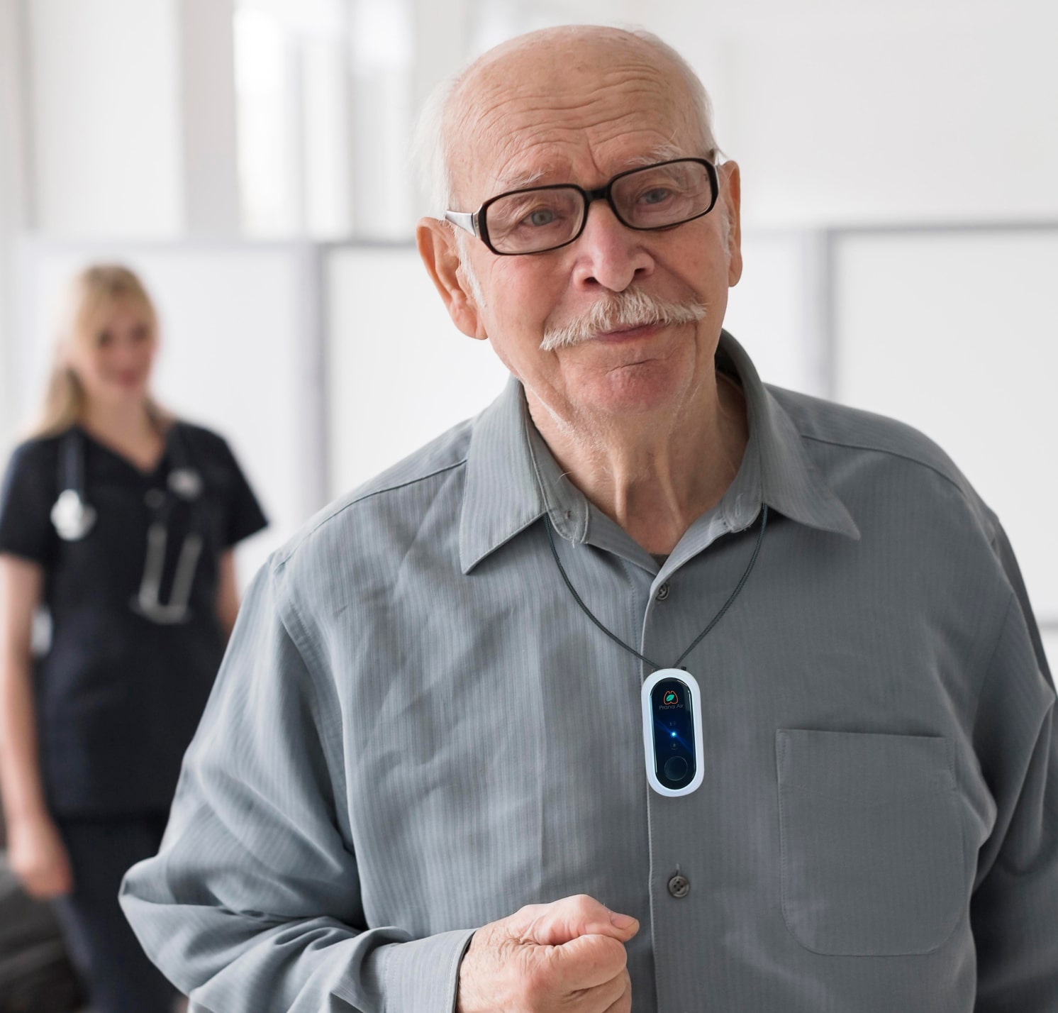 old man using personal air purifier