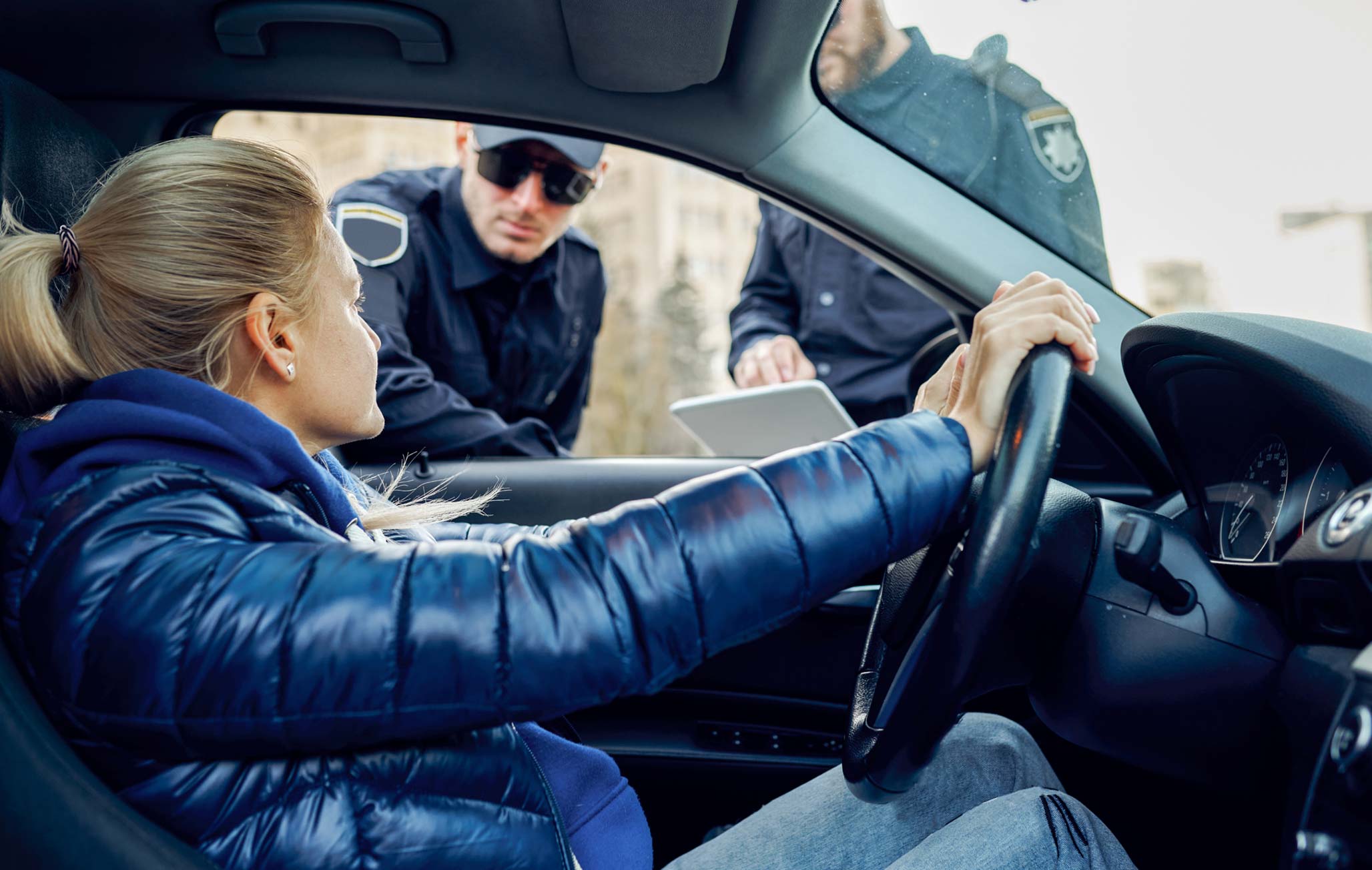 police checking alcohol test with a breathalyzer