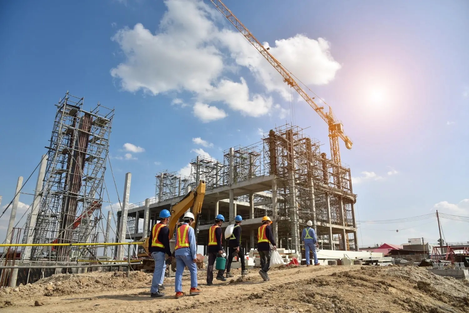 Construction site with dust clouds rising against a city skyline, illustrating air pollution.